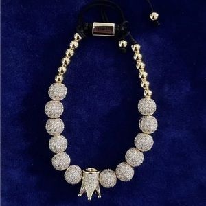 MICRO PAVE SPHERE GOLDTONED ADJUSTABLE BRACELET WITH CROWN BEAD IN VELVET POUCH